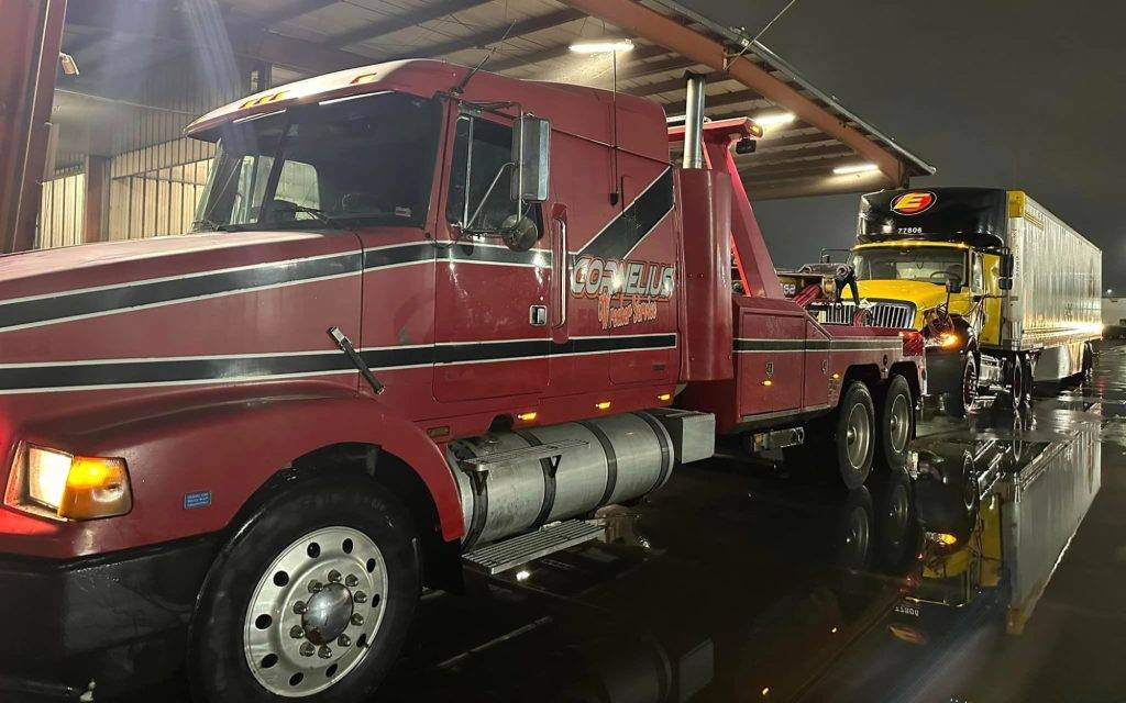 Heavy wrecker truck performing heavy duty RV